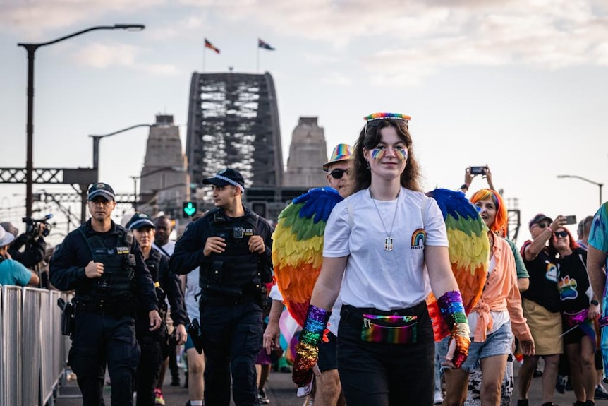 Police walk alongside marchers across Sydney Harbour Bridge