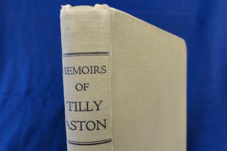 A close-up of the spine of a book entitled 'memoirs of Tilly Aston'.