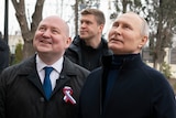 Vladimir Putin (right) and Sevastopol Governor looking up.