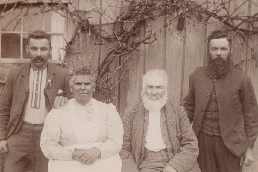 A sepia-coloured archival photo of an older Fanny Smith, William Smith and two of their younger sons.