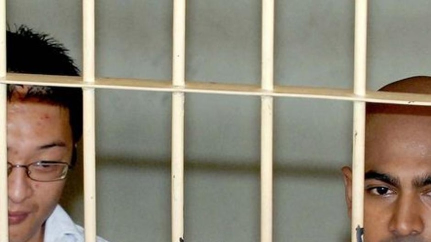 LtoR Andrew Chan and Myuran Sukumaran behind bars in Bali.