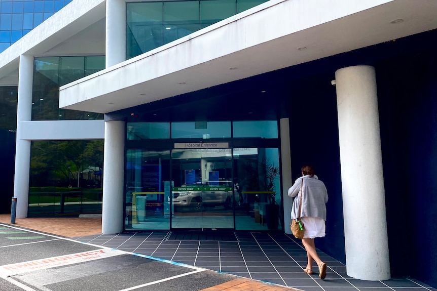 woman walking into entry of John Flynn hospital