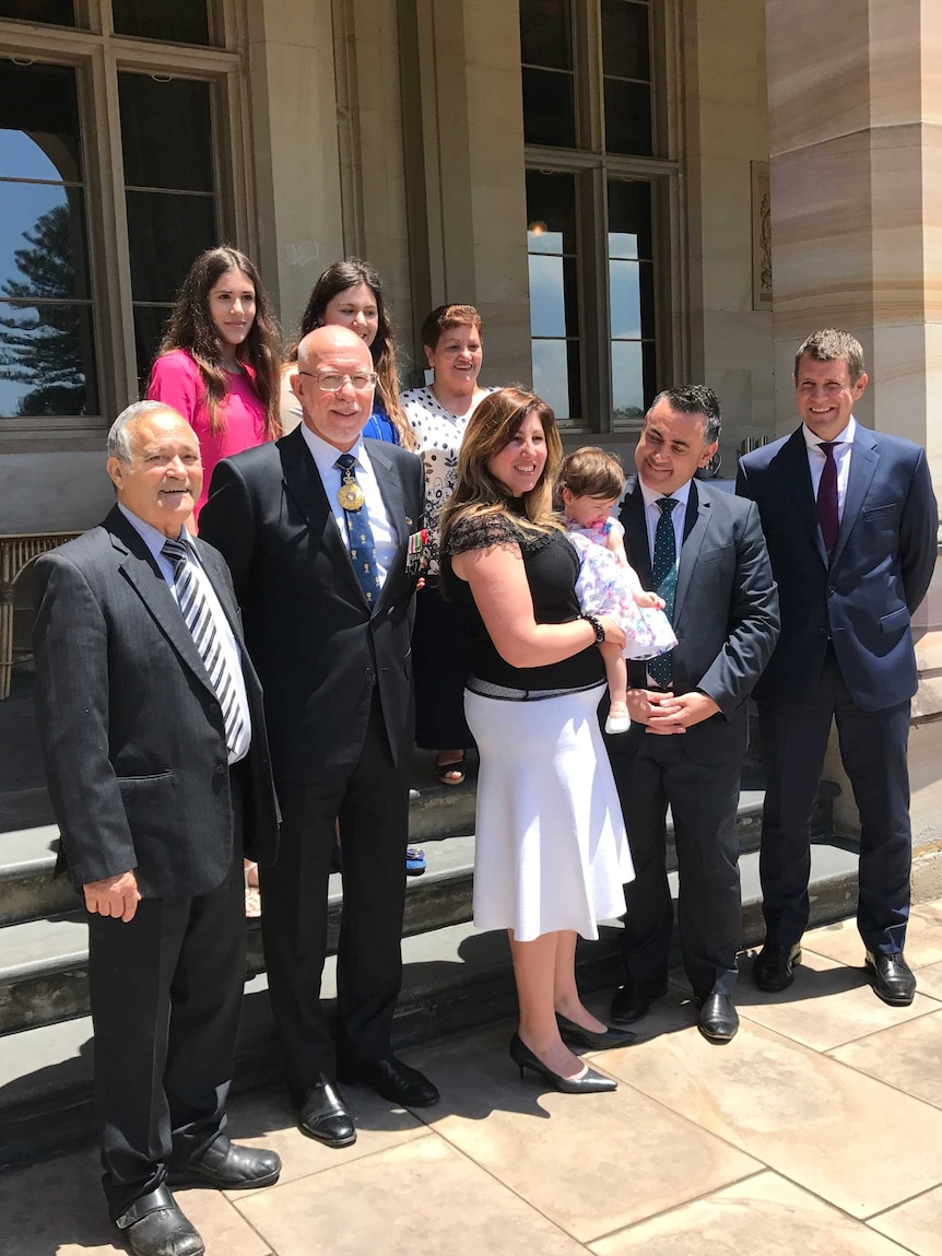 NSW Deputy Premier John Barilaro stands outside NSW Government House with his family.