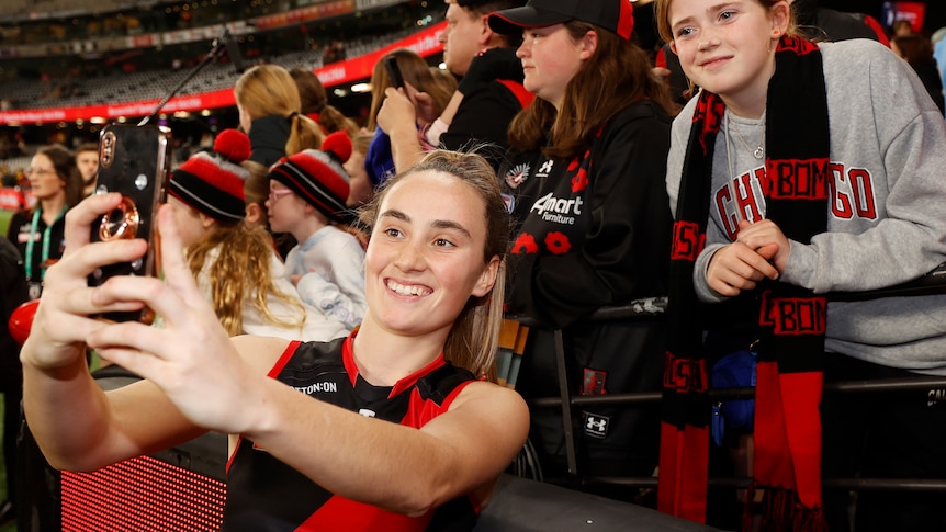 Play Audio. AFLW star Georgia Gee poses with a fan after Essendon's first game. Duration: 48 minutes 25 seconds
