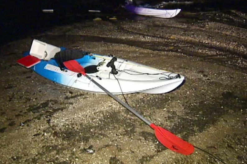 Two kayaks on the beach at Point Wilson.