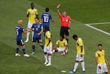 Referee shows a red card to Colombian player Carlos Sanchez