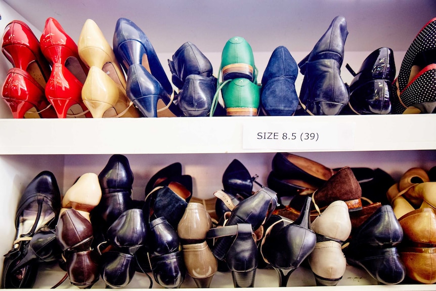 Rows of colourful womens shoes on shelves