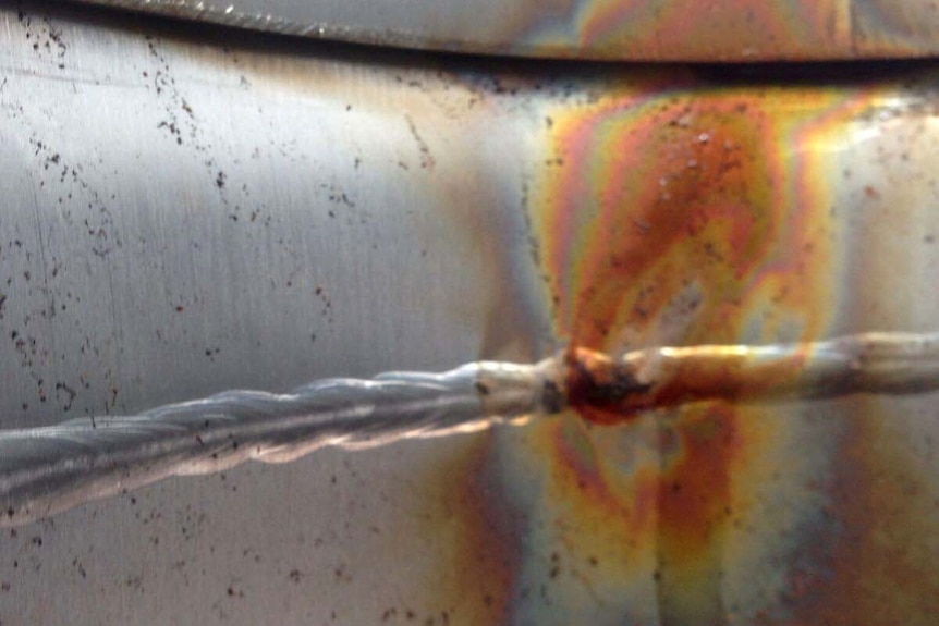 A vivid orange corrosion stain on a stainless tell drinking water pipe from Perth Children's Hospital.
