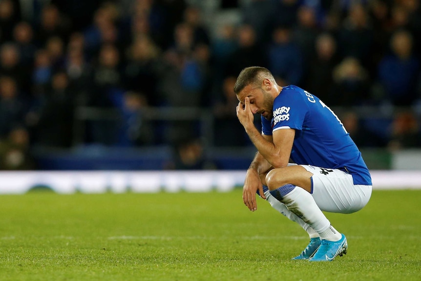 Cenk Tosun sits down on his haunches