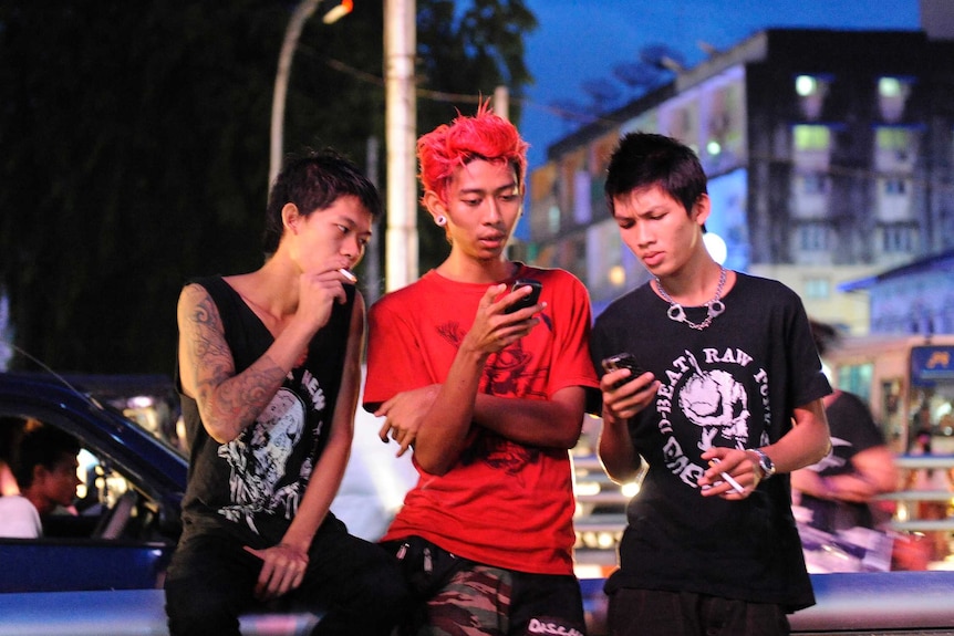 Kyaw Kyaw and friends are busy on their mobile phones