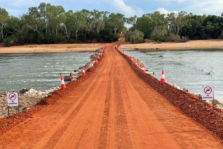 A red road across a river