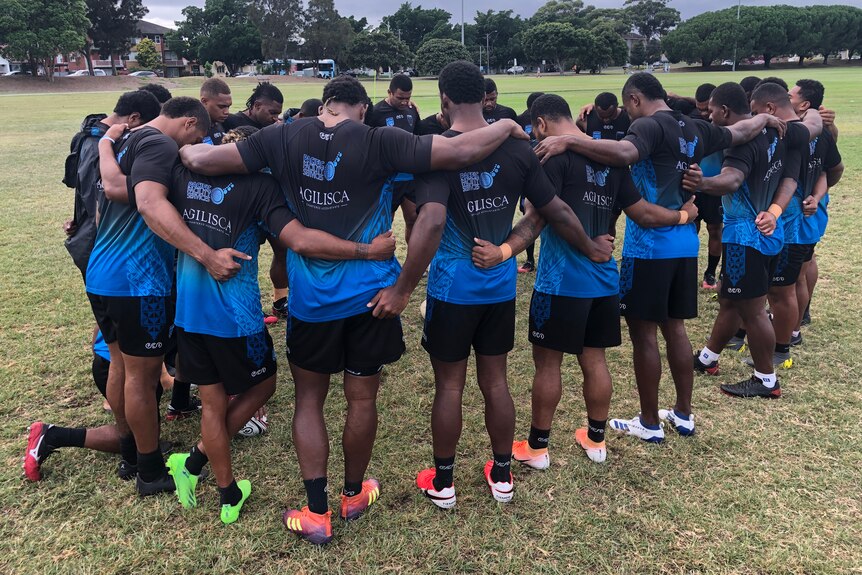 Kaitviti Silktails players gather in a circle at a training session in Sydney, 2021.