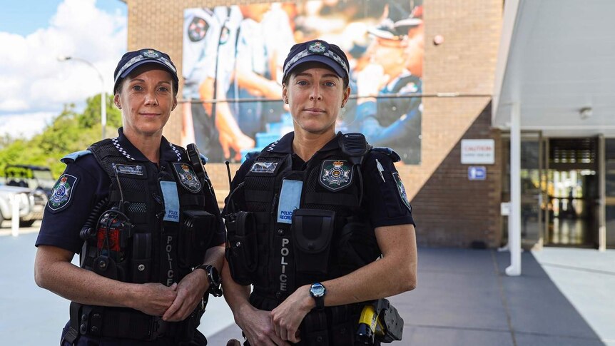 Margot Menkens (L) and Erin Donaldson standing in the Oxley police academy.