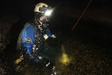 Stephen Fordyce in cave water.