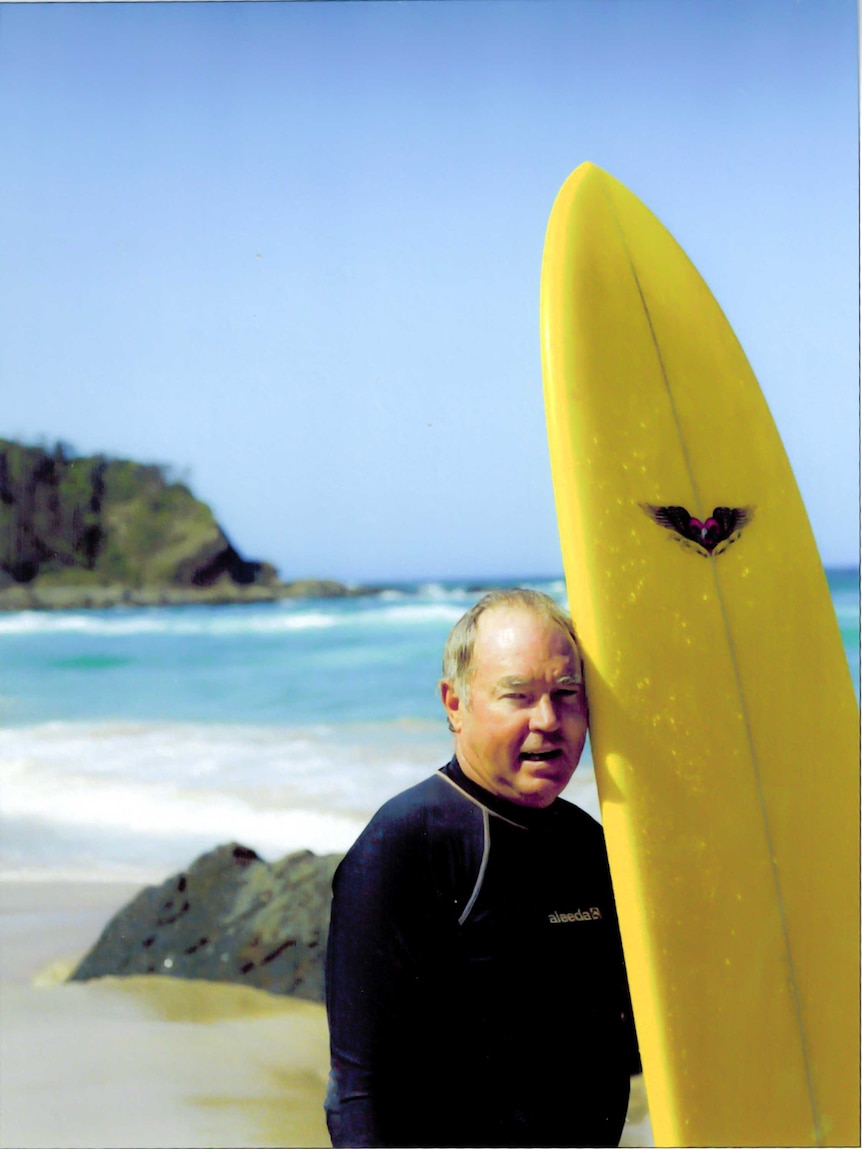 Lester Brien with surfboard