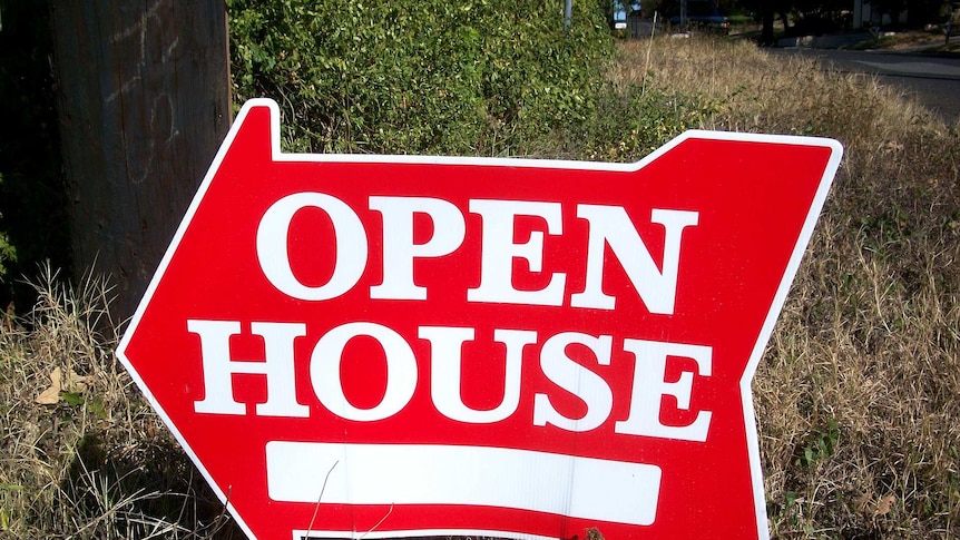 A red sign in the shape of an arrow reads "open house"