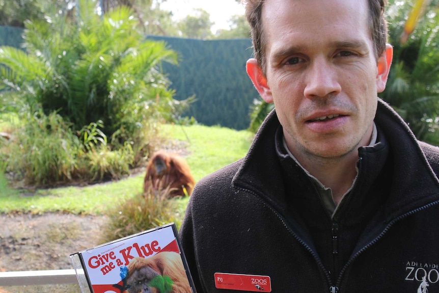 Pij Olijnyk with a signed copy of Sumatran orangutan Kluet's song.