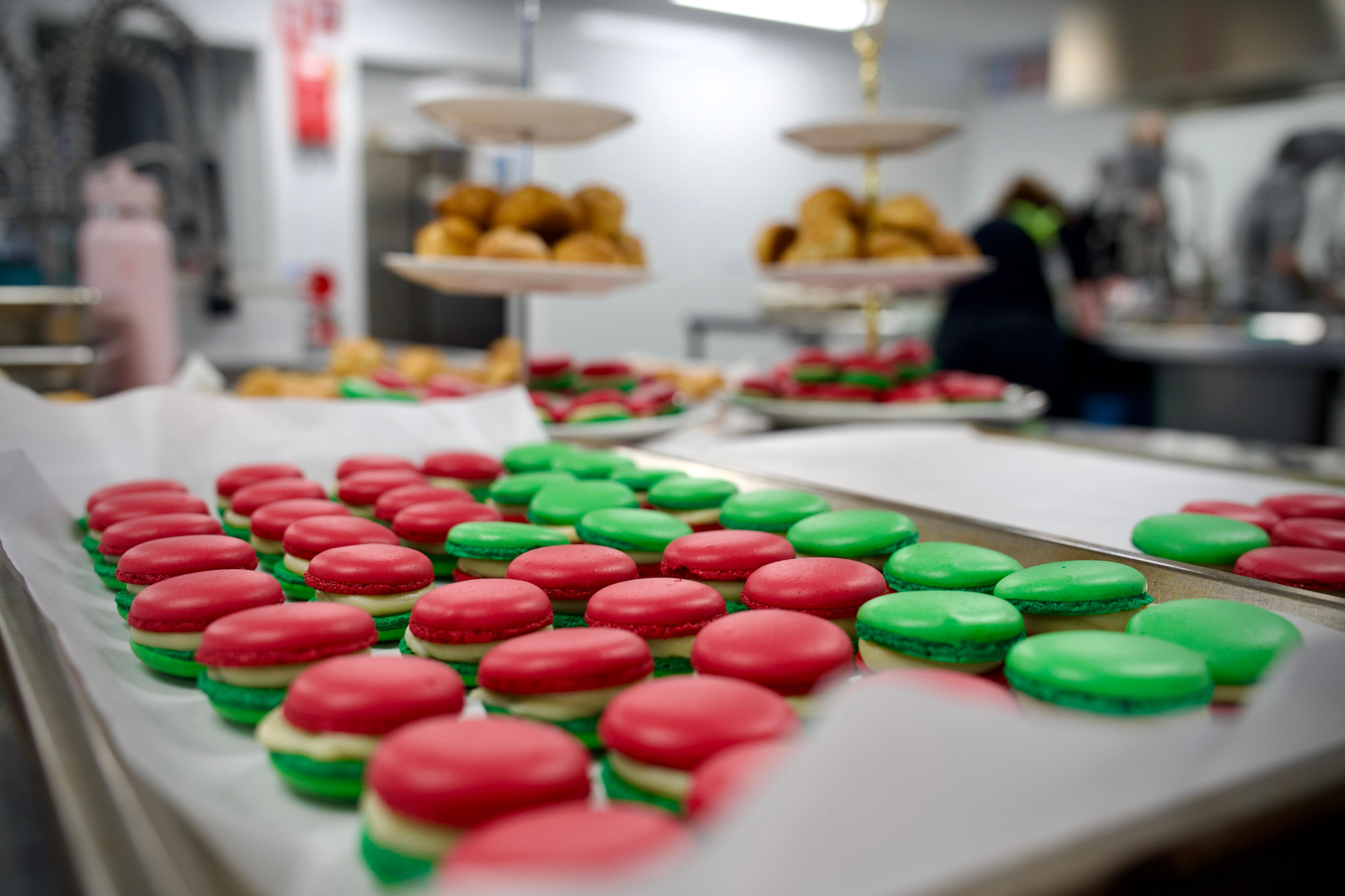 Red and green macaroons sit on trays ready to be served at the National Indigenous Culinary Institute graduation