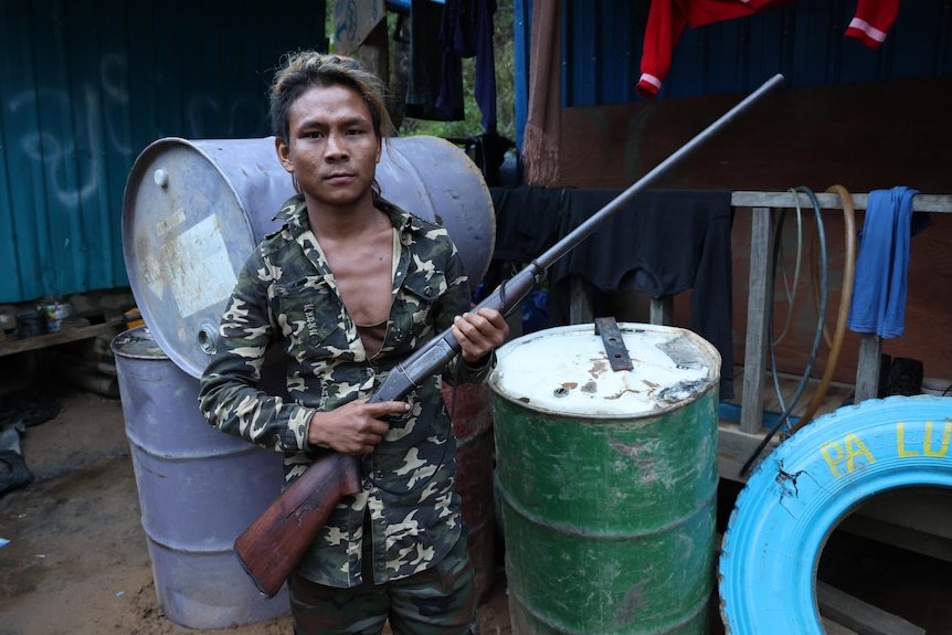 A soldier in Chinland holds a primitive one-shot hunting rifle. 