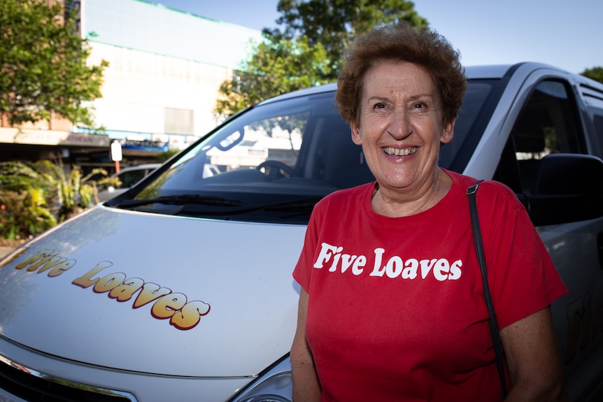 Woman in Five Loaves t-shirt next to Five Loaves van