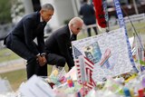 Barack Obama and VP Joe Biden place flowers at Orlando memorial.