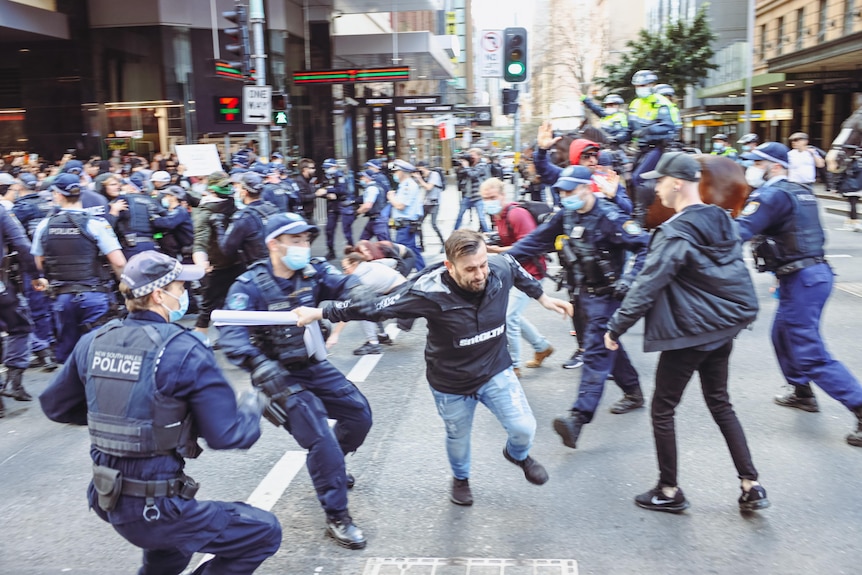 a man is surrounded by nsw police