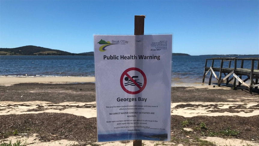 Sewage warning sign Georges Bay
