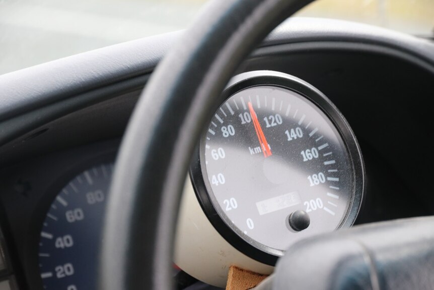 A circular speedometer in a car