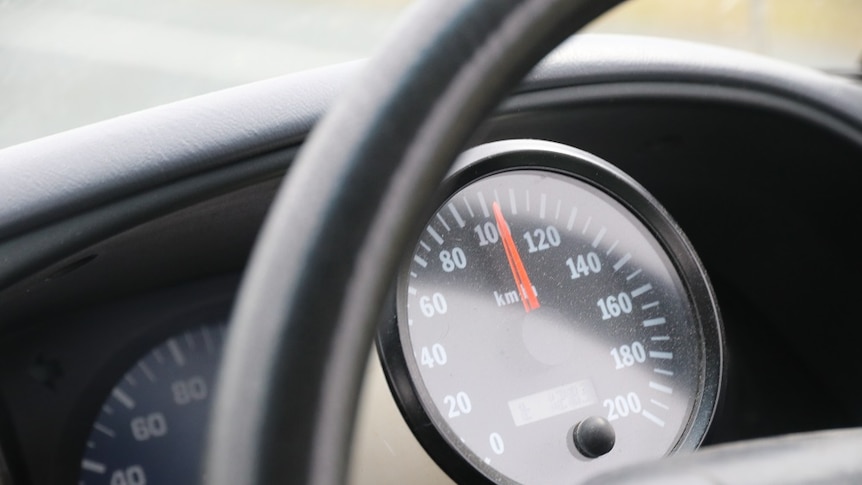 A circular speedometer in a car