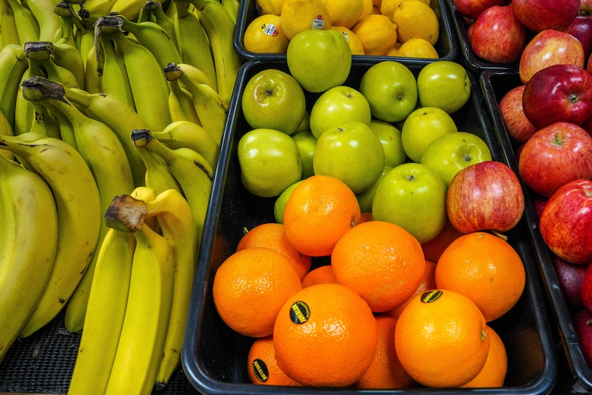 Fruit on sale bananas, apples, oranges