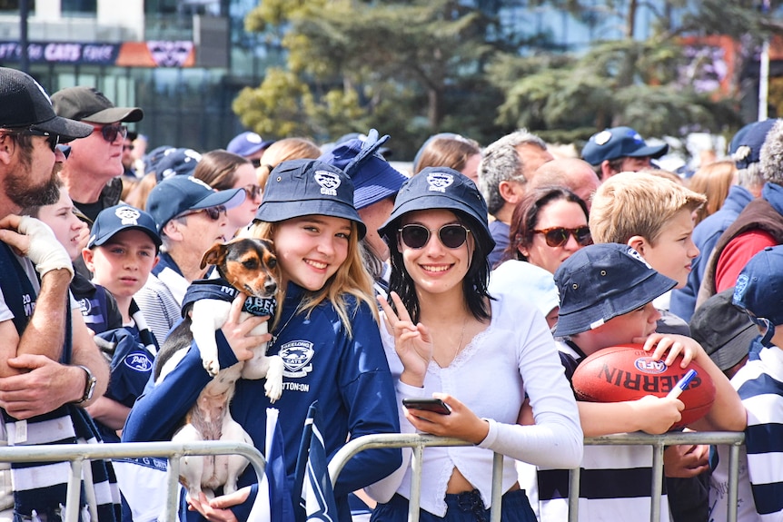 Two young women in Geelong merchandise smile for the camera.