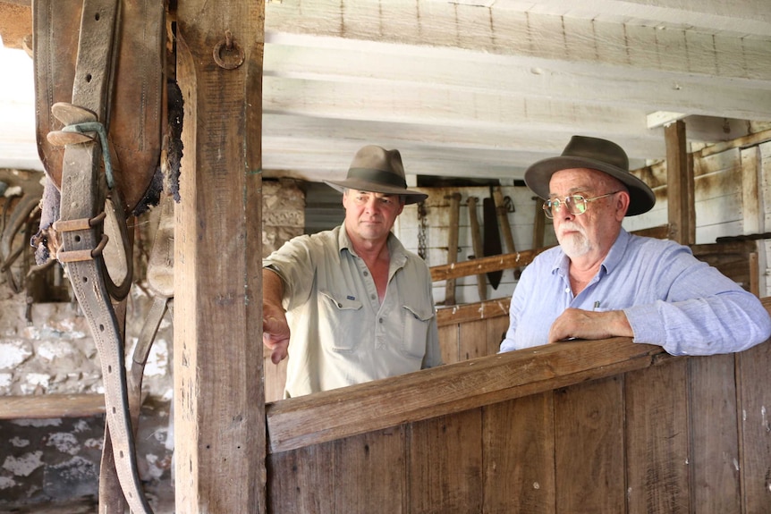 Property owner Nick Dennis and Dr Ian Evans examine burn marks in a 19th century stable.