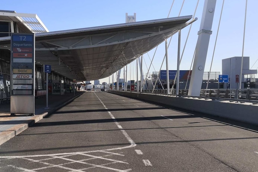 Photo of an empty Sydney airport entrance.