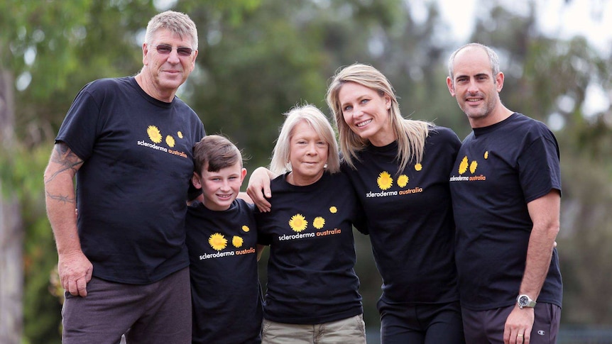Trish Rainbow Noack with her family wearing scleroderma awareness t-shirts