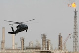 A U.S. helicopter lands at the oil refinery in Baiji, 180 km (112 miles) north of Baghdad February 25, 2009.