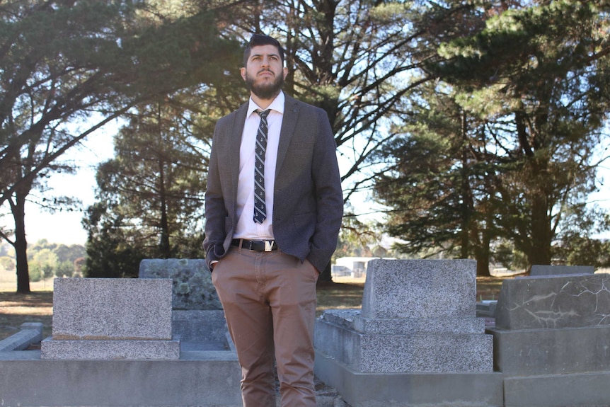 Jameel Qureshi standing at the Blayney cemetery