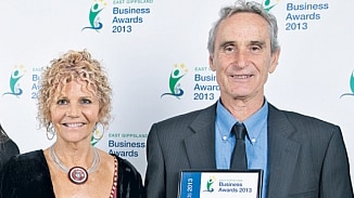 Gerry Menke and Mary Menke winning a Business Award in 2013