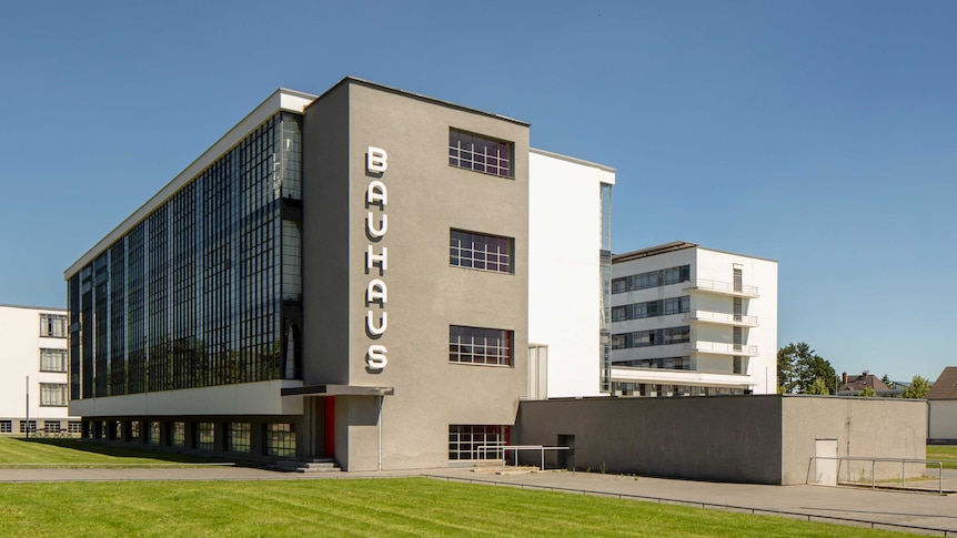 A modernist building with the name "Bauhaus" on its side.