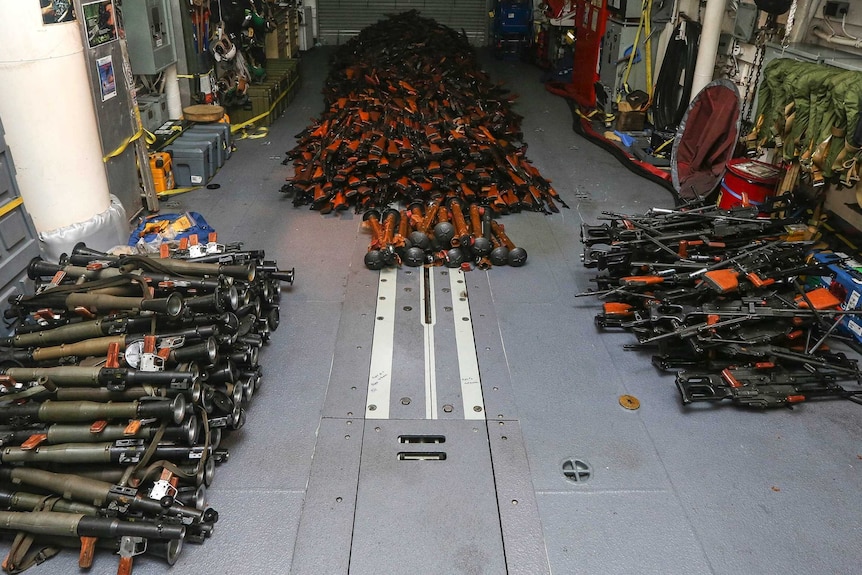HMAS Darwin's boarding team uncovered and seized a large weapons cache