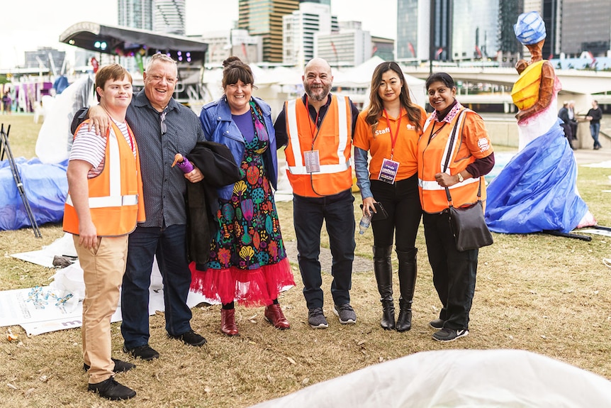 Multicultural Development Australia CEO Kerrin Benson at an event standing 3rd from left in group of six people.