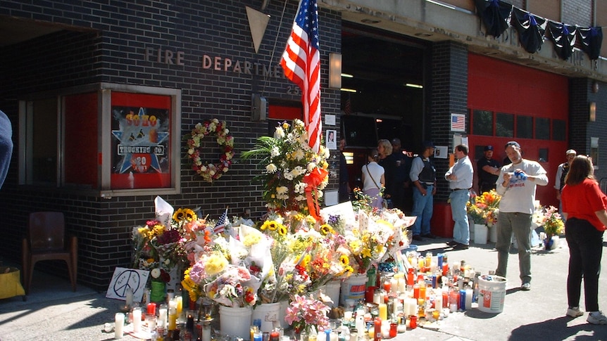 A floral tribute sits outside a New York fire station after the September 11 attacks in 2001.