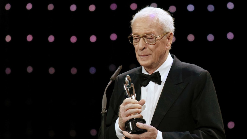 Actor Sir Michael Caine accepts his honoury award during the 28th European Film Award ceremony