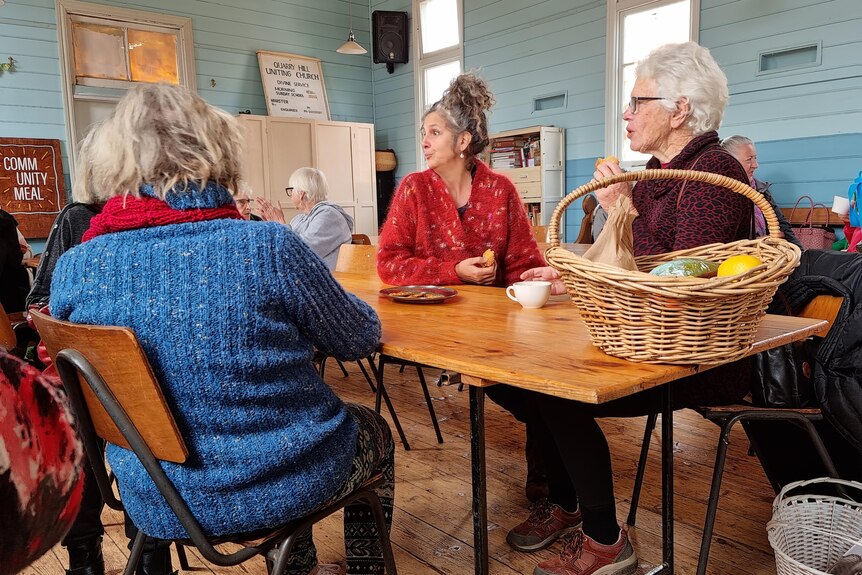A group of older women enjoying lunch at the Old Church on the Hill