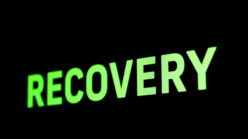 Greens sign saying Recovery on a black background