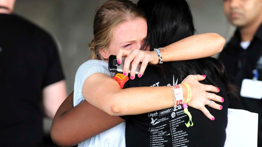 Schoolies comfort each other after high-rise death