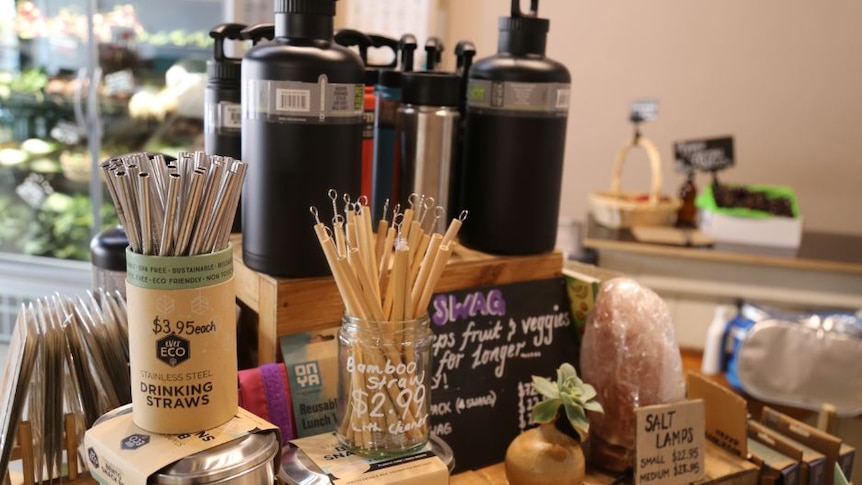 A selection of reusable straws and cups available at an Adelaide shop