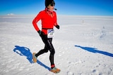 A woman running in Antarctica.
