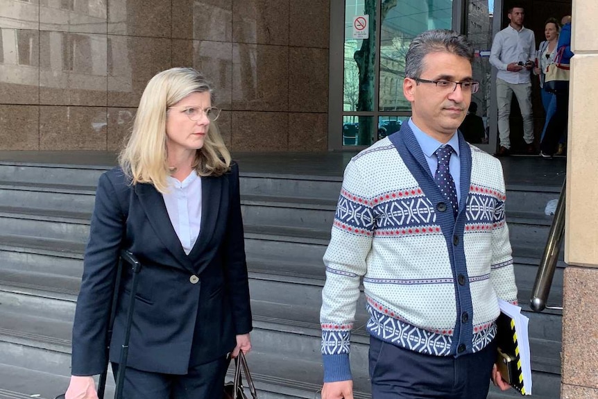Seyyed Ali Farshchi, wearing a patterned cardigan, leaves the Melbourne Magistrates Court.