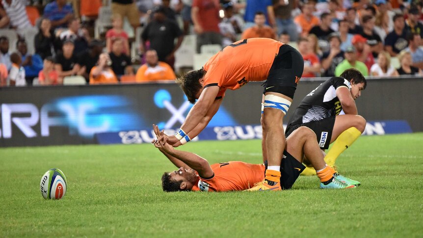 Jaguares players celebrate their first Super Rugby win