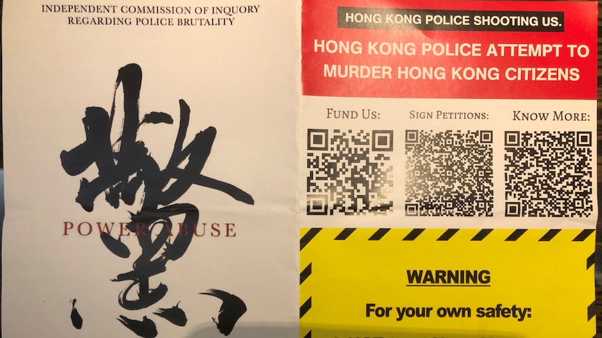 A close-up photo of a flyer says not to trust the Hong Kong police, as it calls on an inquiry into police brutality.